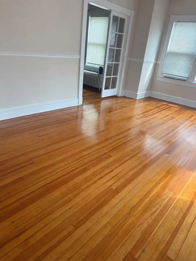 Empty room with polished wood floors